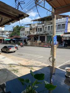 a view of a street with a car on the road at Royce Boutique Betong in Betong