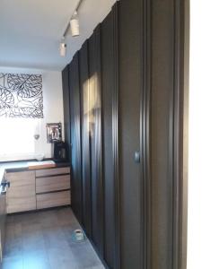 a large wooden closet in a room at Centrum 9 in Kołobrzeg