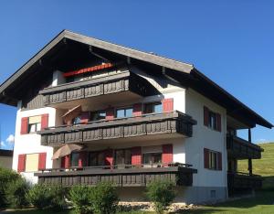 a large building with balconies on the side of it at Glückspilz in Obermaiselstein