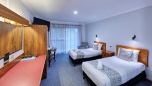 Ένα ή περισσότερα κρεβάτια σε δωμάτιο στο Kempsey Powerhouse Motel +57 φωτογραφίες