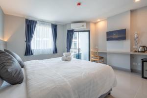 Postel nebo postele na pokoji v ubytování Cozy Blu Suvarnabhumi