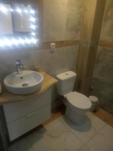 a bathroom with a toilet and a sink and a shower at Hanter5 in Jugów