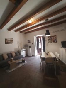 a living room with a couch and a table at La Picci in Catania
