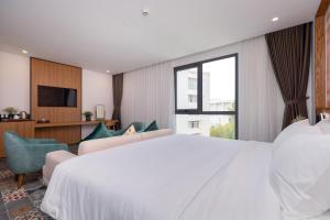 Postel nebo postele na pokoji v ubytování Petro House Vung Tau - Block A