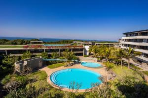 an overhead view of a resort with a swimming pool at Modern Garden Unit in Pebble Beach in Umhlanga