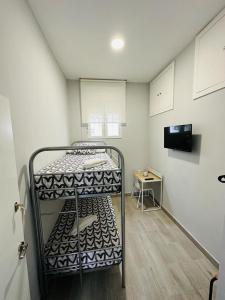 Łóżko lub łóżka w pokoju w obiekcie HOSPEDAJE CUATRO VIENTOS