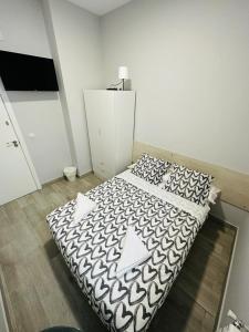 Łóżko lub łóżka w pokoju w obiekcie HOSPEDAJE CUATRO VIENTOS