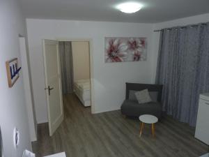 a small living room with a couch and a table at APARTMENT KAYA in Zadar