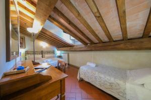 A bed or beds in a room at San Tommaso