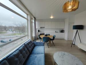 a living room with a couch and a table at Eindhoven City Apartments G 4P in Eindhoven