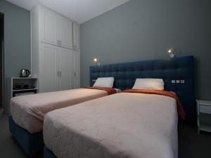 Postel nebo postele na pokoji v ubytování Hotel Marvel