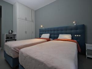 Postel nebo postele na pokoji v ubytování Hotel Marvel