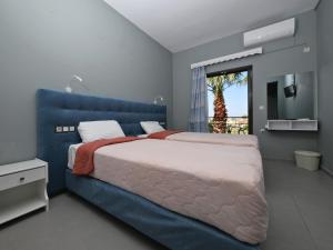 Postel nebo postele na pokoji v ubytování Hotel Marvel