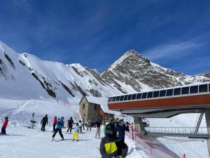 a group of people on a snow covered mountain at Hôtel Saint Clair in Lourdes