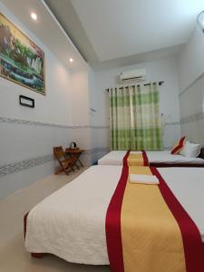 Postel nebo postele na pokoji v ubytování Motel Toàn Thắng