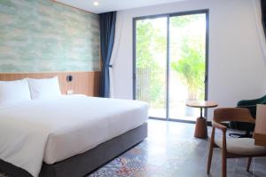 Postel nebo postele na pokoji v ubytování Petro House Vung Tau - Block A