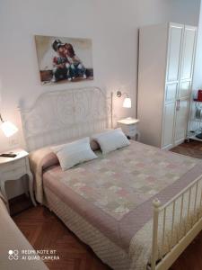 a bedroom with a large bed with two pillows on it at AL 171 Locazione Turistica a 50mt metro B1 in Rome