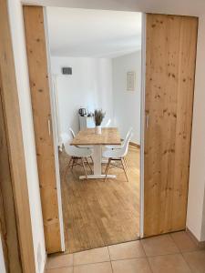 a dining room with a table and chairs at La Fontaine de Vinsobres in Vinsobres +33 photos