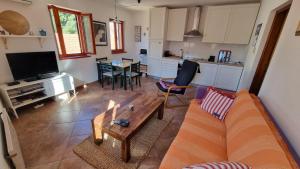a living room with a couch and a table at Old Harbour in Novigrad Istria