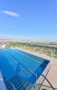 a large swimming pool on the top of a building at Skyscraper-Feeling With Parking Nearby in Vienna