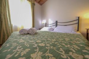 A bed or beds in a room at San Tommaso