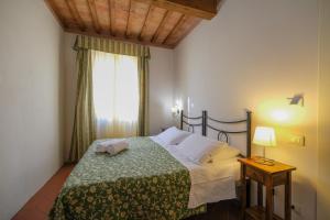 A bed or beds in a room at San Tommaso