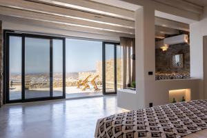 Ένα ή περισσότερα κρεβάτια σε δωμάτιο στο Makani Suites +175 φωτογραφίες
