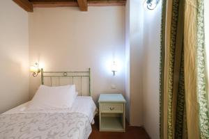 A bed or beds in a room at San Tommaso