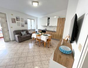 A kitchen or kitchenette at NaturAmare Apartments Palinuro