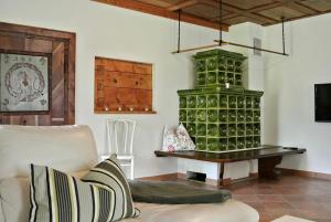 a living room with a large green wine cellar at Ferienhaus Archkogl in Grundlsee