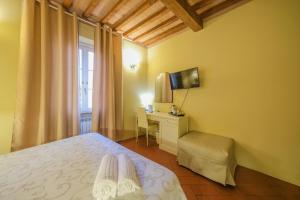 A bed or beds in a room at San Tommaso