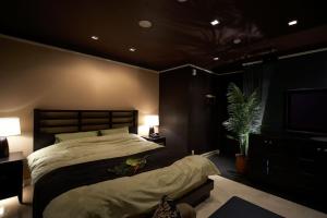 Le Ciel Spa & Resort -Adlt only-にあるベッド