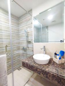 a bathroom with a sink and a shower at Pearl of properties in Lahore