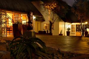 a courtyard of a building at night at Summerhill Guest Estate in Pinetown