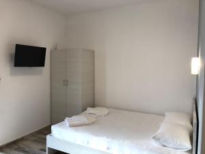 Postel nebo postele na pokoji v ubytování Be Happy Apartments
