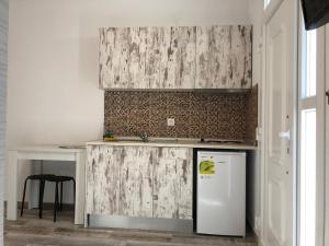 Kuchyň nebo kuchyňský kout v ubytování Be Happy Apartments