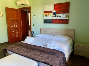 A bed or beds in a room at Villa Culla di Jana