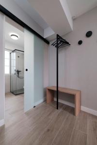 a room with a walkin closet and a bench in it at PR 25 de Julio in Santiago de Compostela