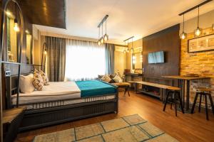 Ένα ή περισσότερα κρεβάτια σε δωμάτιο στο Cube Suites