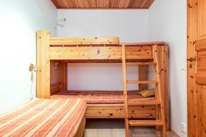 Poschodová posteľ alebo postele v izbe v ubytovaní Kotatie 6