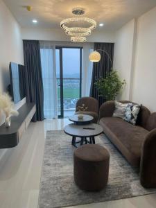 a living room with a couch and a table at Noric homestay in Hue