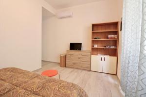 A television and/or entertainment centre at Rif. B3 - SAMUELE
