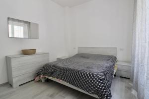A bed or beds in a room at Rif. B3 - SAMUELE