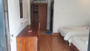 Postel nebo postele na pokoji v ubytování Edo Homestay & Restaurant