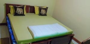 Postel nebo postele na pokoji v ubytování New Mount Villa