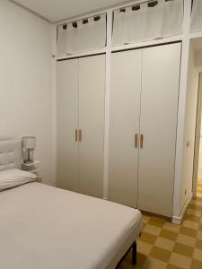 Postel nebo postele na pokoji v ubytování SEABAUDIA1 CON TERRAZZA