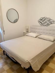 Postel nebo postele na pokoji v ubytování SEABAUDIA1 CON TERRAZZA