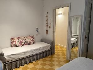Postel nebo postele na pokoji v ubytování SEABAUDIA1 CON TERRAZZA