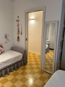 Postel nebo postele na pokoji v ubytování SEABAUDIA1 CON TERRAZZA