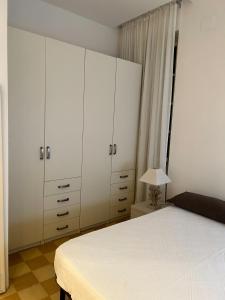 Postel nebo postele na pokoji v ubytování SEABAUDIA1 CON TERRAZZA